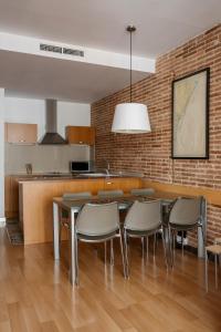 A kitchen or kitchenette at Wello Apartments