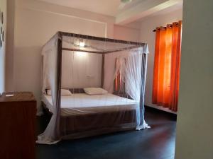Letto o letti in una camera di Sunstyle Mirissa Guest House