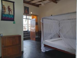Letto o letti in una camera di Sunstyle Mirissa Guest House