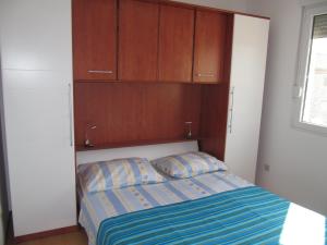 Postel nebo postele na pokoji v ubytování Apartmani Marino