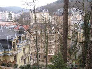 a large building in the middle of a city at Apartment Sadova in Karlovy Vary