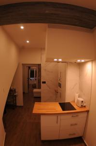 a kitchen with white cabinets and a counter top at APARTAMENTOs URDAIBAI 2 in Bermeo