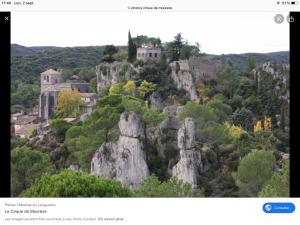 a picture of a mountain with a castle on it at Entre mer et lac Salagou in Saint-André-de-Sangonis +4 photos