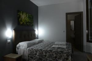 Łóżko lub łóżka w pokoju w obiekcie Hotel Oregon