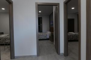 Łóżko lub łóżka w pokoju w obiekcie Hotel Oregon