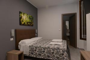 Łóżko lub łóżka w pokoju w obiekcie Hotel Oregon