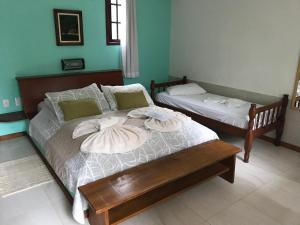 Cama ou camas em um quarto em Pousada Caúca