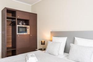 Postel nebo postele na pokoji v ubytování Penzion Apartmány Hradební