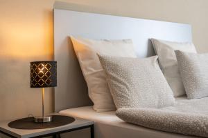 Postel nebo postele na pokoji v ubytování Penzion Apartmány Hradební