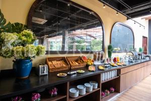 a kitchen with a counter with food on it at Hotel Morrison Usaquén in Bogotá