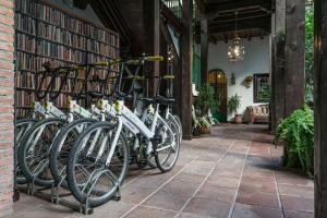 
bikes parked in front of a brick building at El Rey Moro Hotel Boutique in Seville

