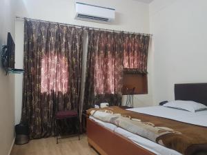 Postel nebo postele na pokoji v ubytování Hotel Sweet Dream