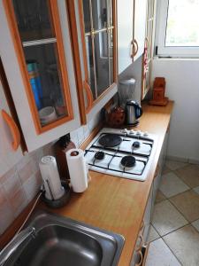 a kitchen counter with a stove and a sink at SEASIDE VACATION RENTAL 4TUNA in Krk