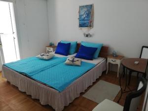 Postel nebo postele na pokoji v ubytování Apartmani Paula