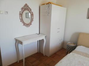 Postel nebo postele na pokoji v ubytování Apartmani Paula
