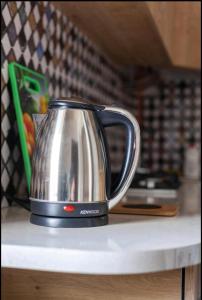 a tea kettle sitting on top of a counter at Your apartment in Old Tbilisi-Ortachala in Tbilisi City