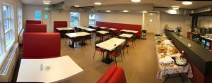 an overhead view of a restaurant with tables and chairs at Hotel Nuka in Ilulissat