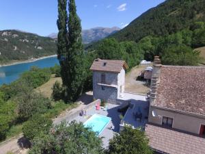 an aerial view of a house with a swimming pool at le Mas du lac - spa et détente in Monestier-dʼAmbel