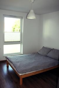 Posteľ alebo postele v izbe v ubytovaní Apartament Spacerowa