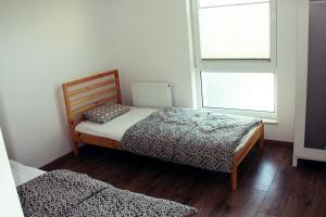 Posteľ alebo postele v izbe v ubytovaní Apartament Spacerowa