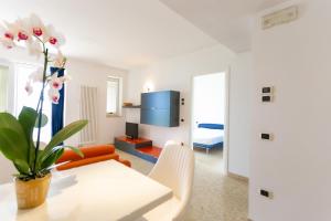 A seating area at Le Murrine Frontemare Apartment Seaview