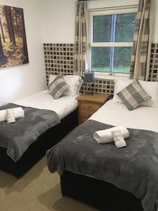 Ένα ή περισσότερα κρεβάτια σε δωμάτιο στο Inchmarlo villa27