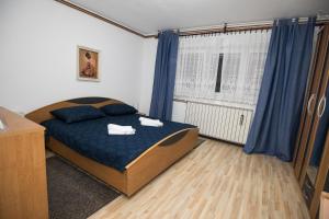 Tempat tidur dalam kamar di apartman tušek-Bjelovar