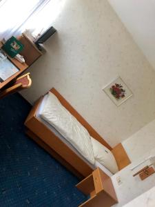 Postel nebo postele na pokoji v ubytování Gasthof Waldesruh