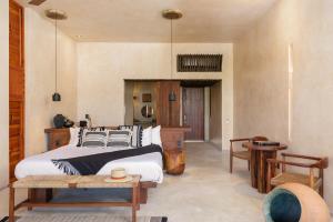 Postel nebo postele na pokoji v ubytování Hotel Ma'xanab Tulum