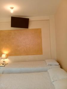 Voodi või voodid majutusasutuse HOTEL MAISON FIORI (Centro) toas