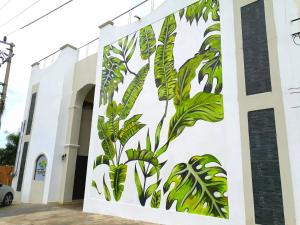a mural on the side of a building at Hotel Tuparenda in Bacalar