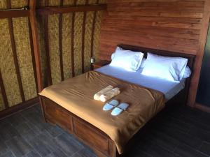 Een bed of bedden in een kamer bij Kintamani Cabins
