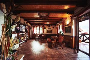 a dining room with chairs and a table in a building at 12 Місяців-Травень in Slavske
