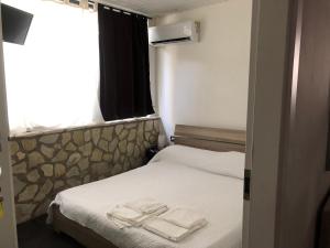 Ένα ή περισσότερα κρεβάτια σε δωμάτιο στο Dolce Vita casa vacanze