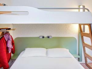 Postel nebo postele na pokoji v ubytování Hotel Ibis Budget Vichy