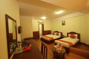 Ένα ή περισσότερα κρεβάτια σε δωμάτιο στο Samsara Boutique Hotel