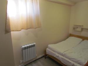 Ένα ή περισσότερα κρεβάτια σε δωμάτιο στο Arsego Hostel