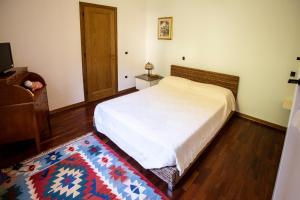 A bed or beds in a room at Il Rifugio