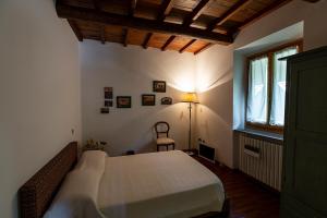 A bed or beds in a room at Il Rifugio
