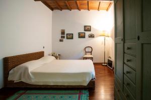A bed or beds in a room at Il Rifugio
