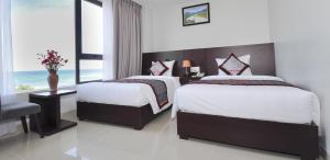 Säng eller sängar i ett rum på Anh Linh 2 Hotel