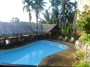 Bazén v ubytování Palau Plantation Resort nebo v jeho okolí