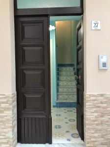 a door leading into a room with a staircase at B&B Margherita in Marina di Camerota