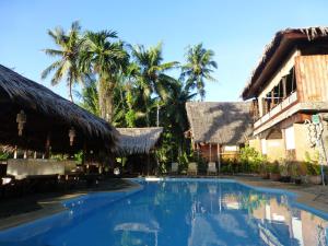 Bazén v ubytování Palau Plantation Resort nebo v jeho okolí