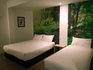 Katil atau katil-katil dalam bilik di H Boutique Hotel Xplorer Loke Yew