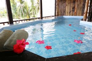 Bazén v ubytování Palau Plantation Resort nebo v jeho okolí