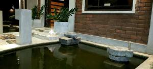 a pool of water with rocks in a building at Cocolagoon eco Resort Nilaveli in Trincomalee