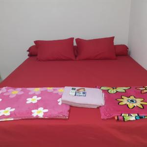 Ένα ή περισσότερα κρεβάτια σε δωμάτιο στο Almira Homestay near Airport