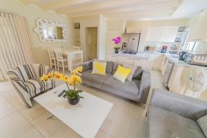 a living room with a couch and a table at Hacienda Wayaca Apartments in Wayaca