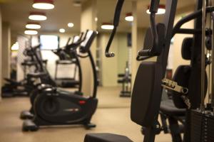 a row of exercise bikes in a gym at Riu Plaza España in Madrid